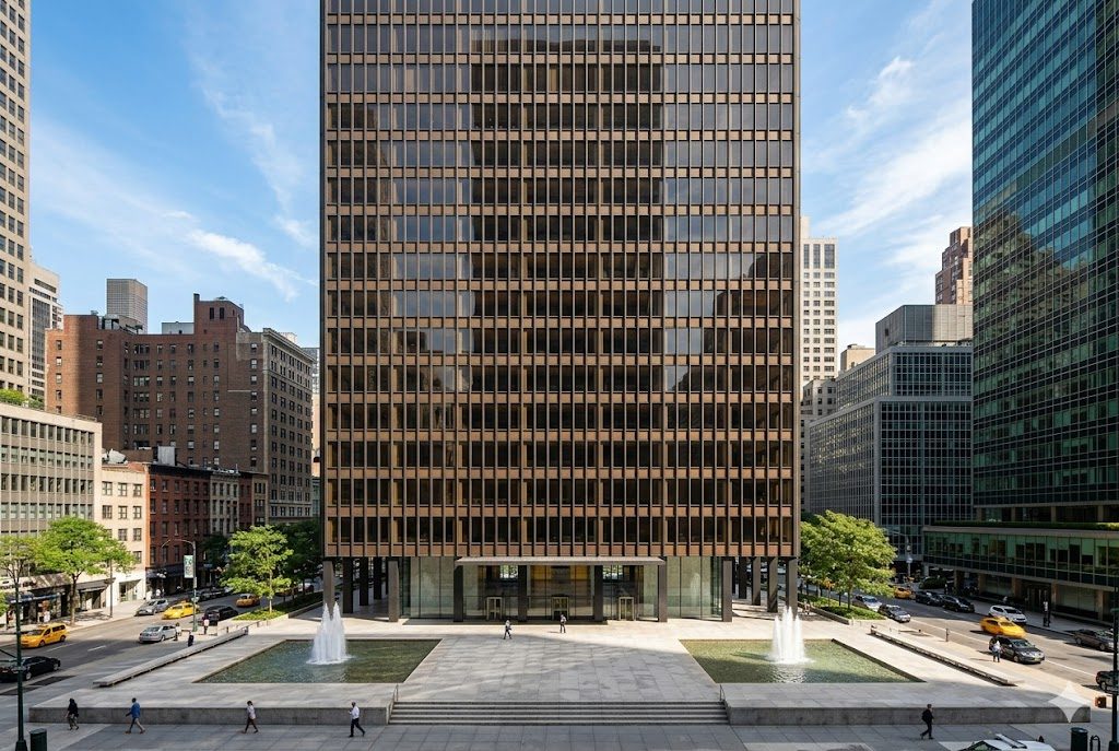 The Seagram Building in New York, a bronze-and-glass curtain-wall tower set back behind an open granite plaza