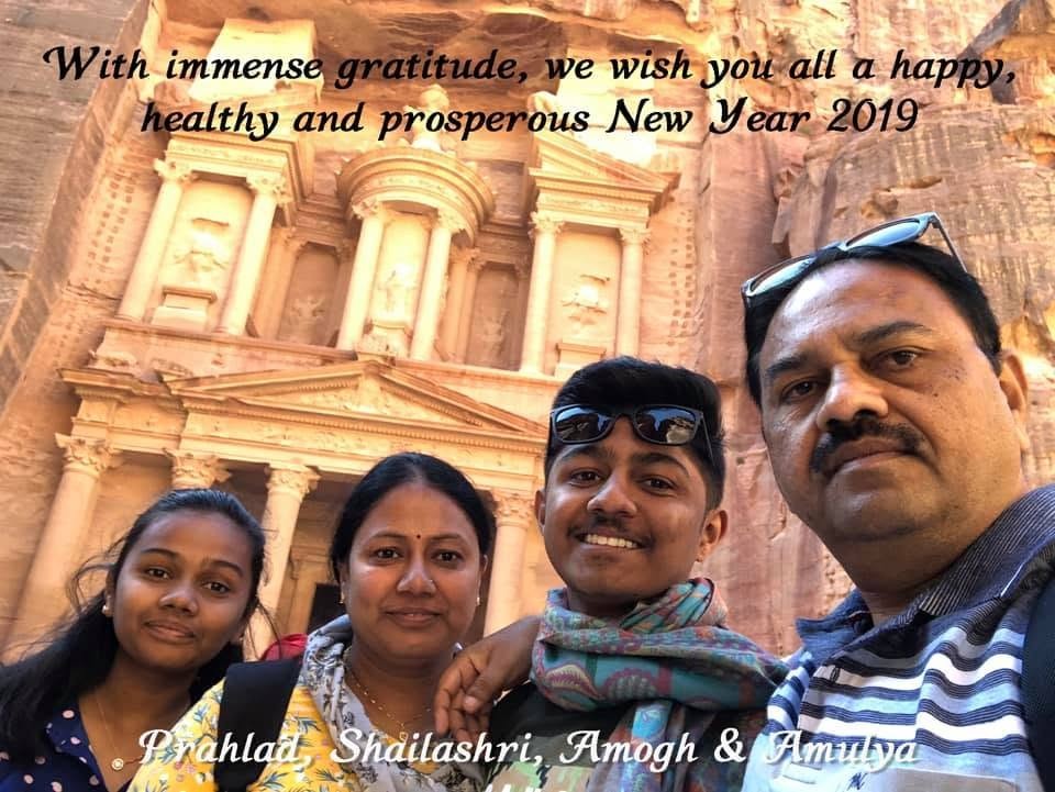 Amogh with his family before the Treasury at Petra — the family's New Year greeting card, 2019