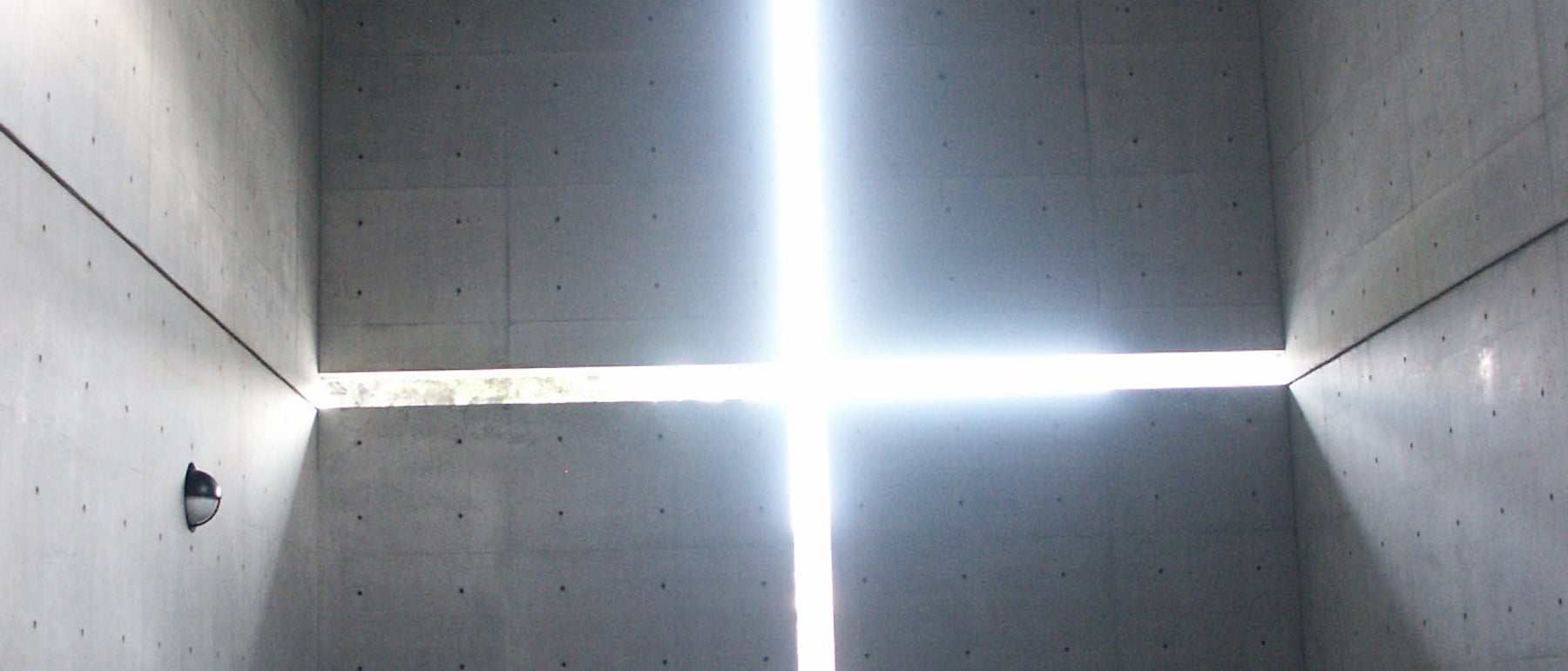 Church of the Light — A cruciform slot of light in concrete — minimalism's power.