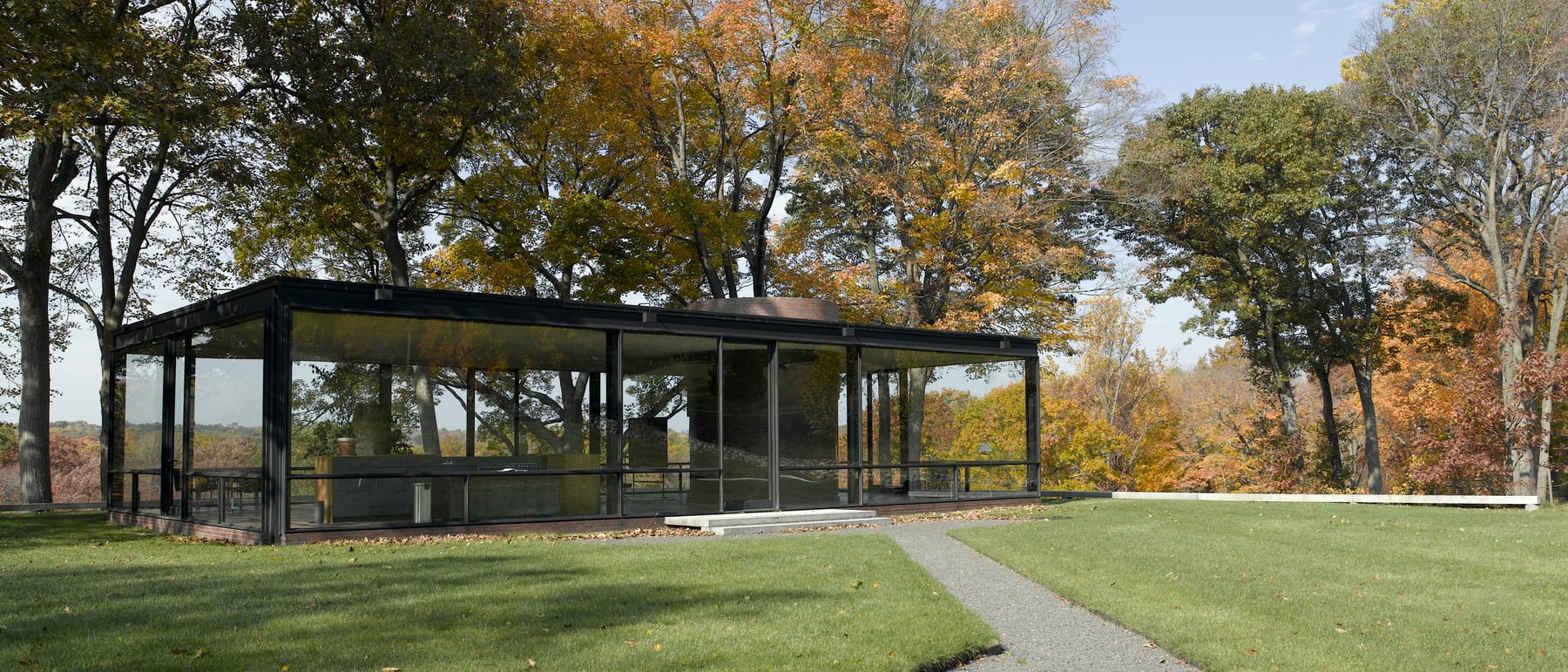 Glass House — Transparency as dwelling.