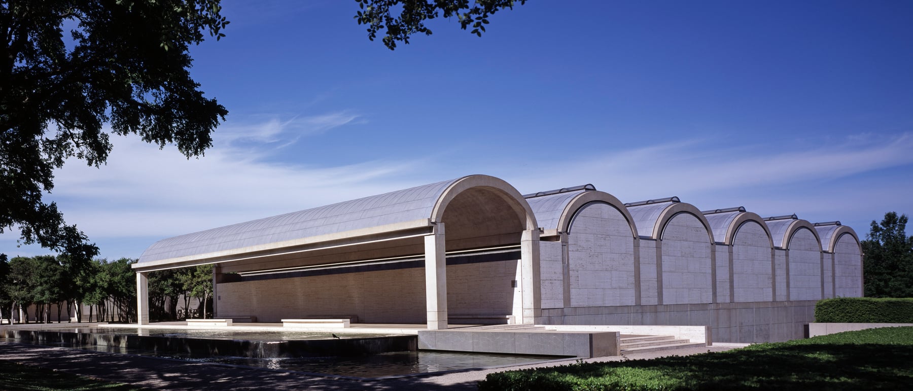 Kimbell Art Museum — Cycloid concrete vaults washed with silver light.