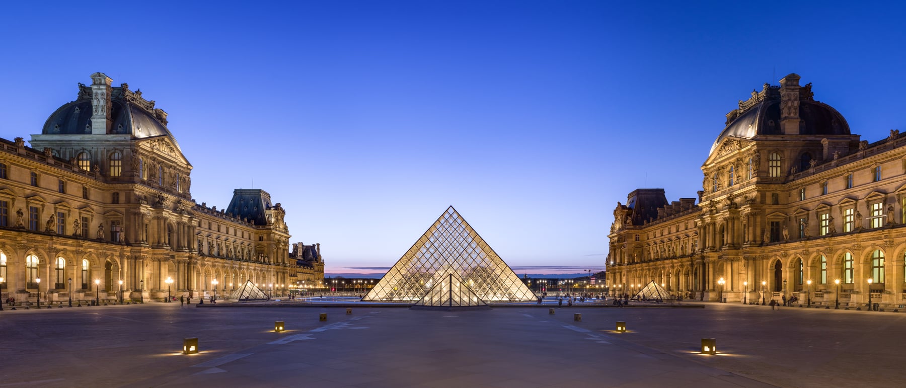 Louvre Pyramid — A glass pyramid mediating old and new.