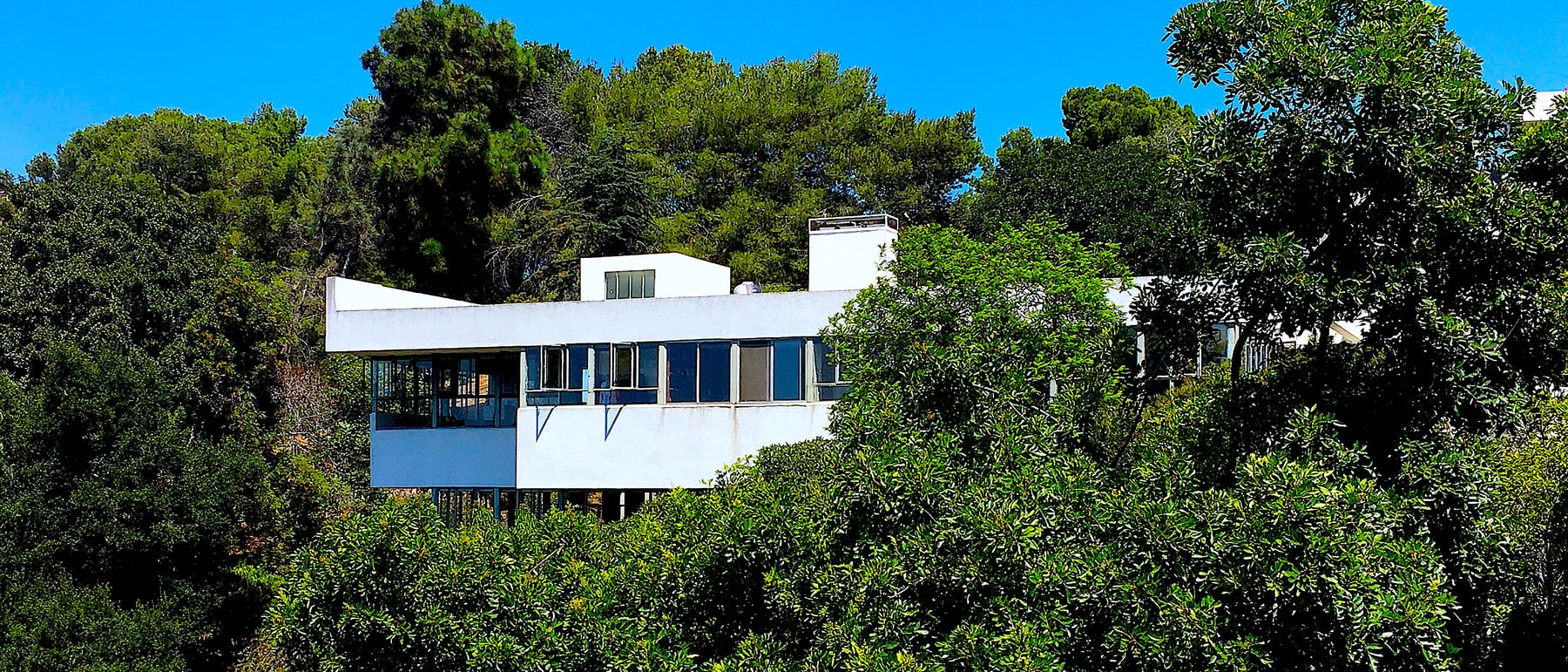 Lovell Health House — A steel-framed modernist house on a hillside.