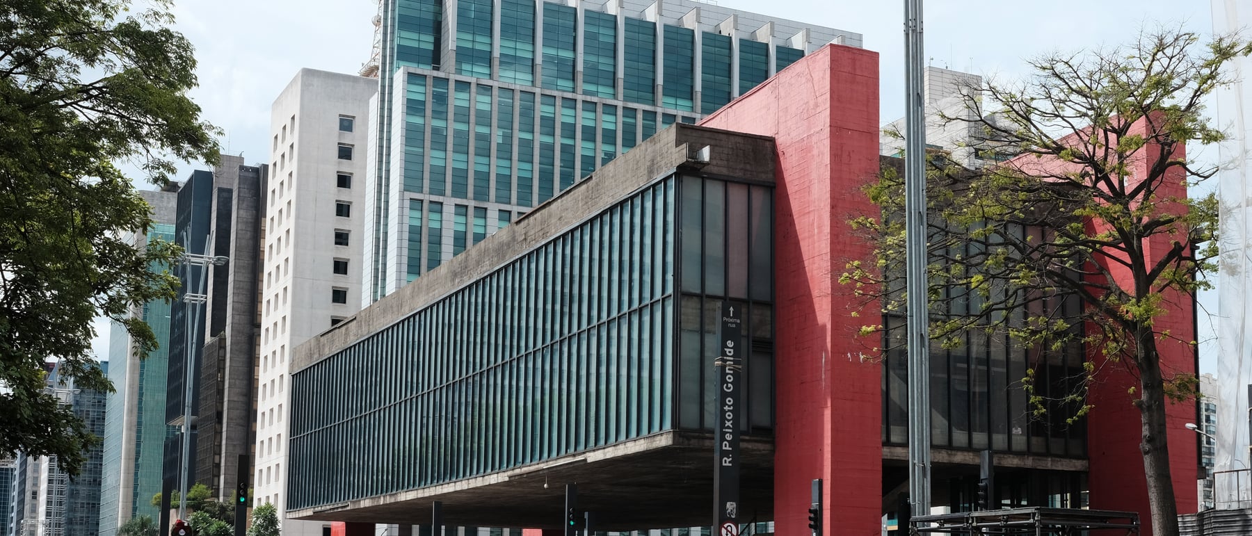 MASP (São Paulo Museum of Art) — A gallery box slung under a red concrete span.