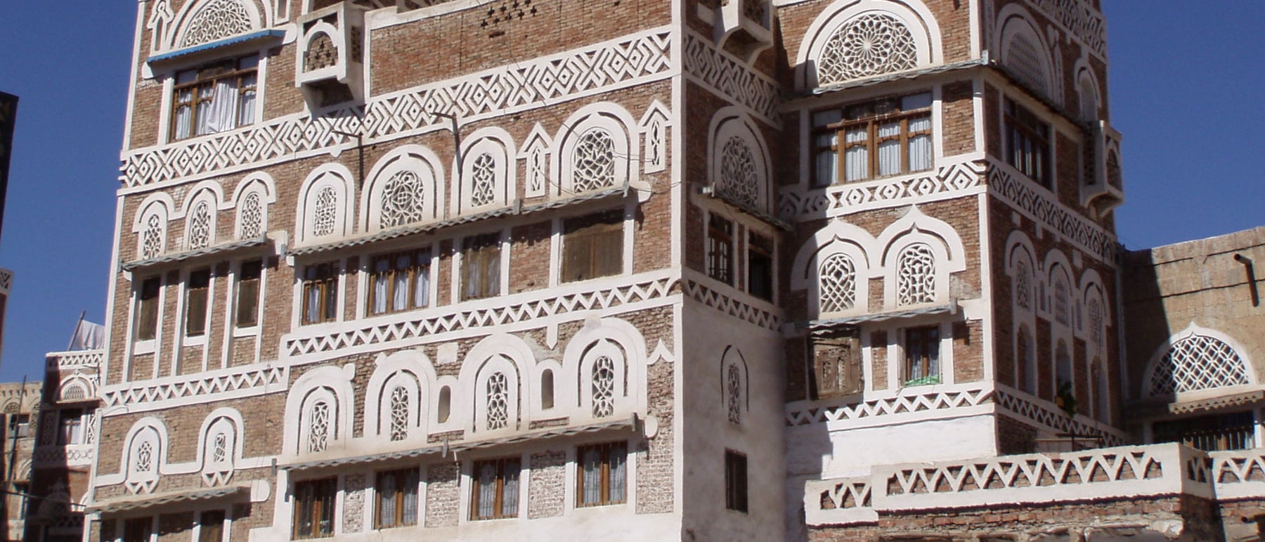 Sana'a Old City — Decorated tower-houses of rammed earth and gypsum.