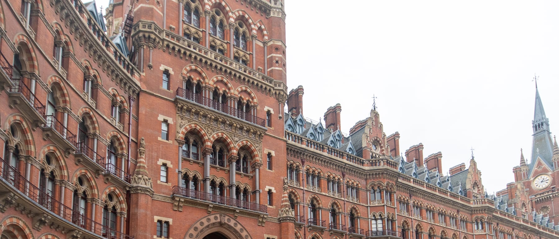 St Pancras Station & Hotel — A vast iron train-shed behind Gothic-revival drama.
