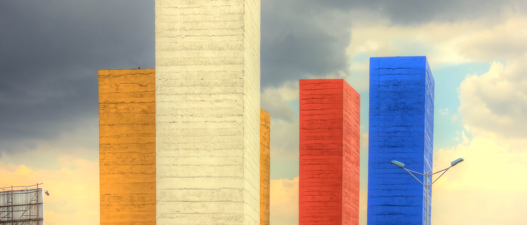 Torres de Satélite — Coloured concrete towers as urban sculpture.