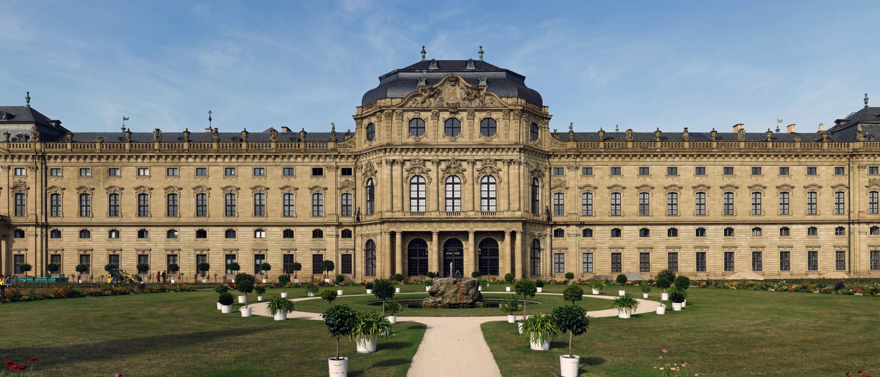 Würzburg Residence — A grand staircase beneath Tiepolo's ceiling.