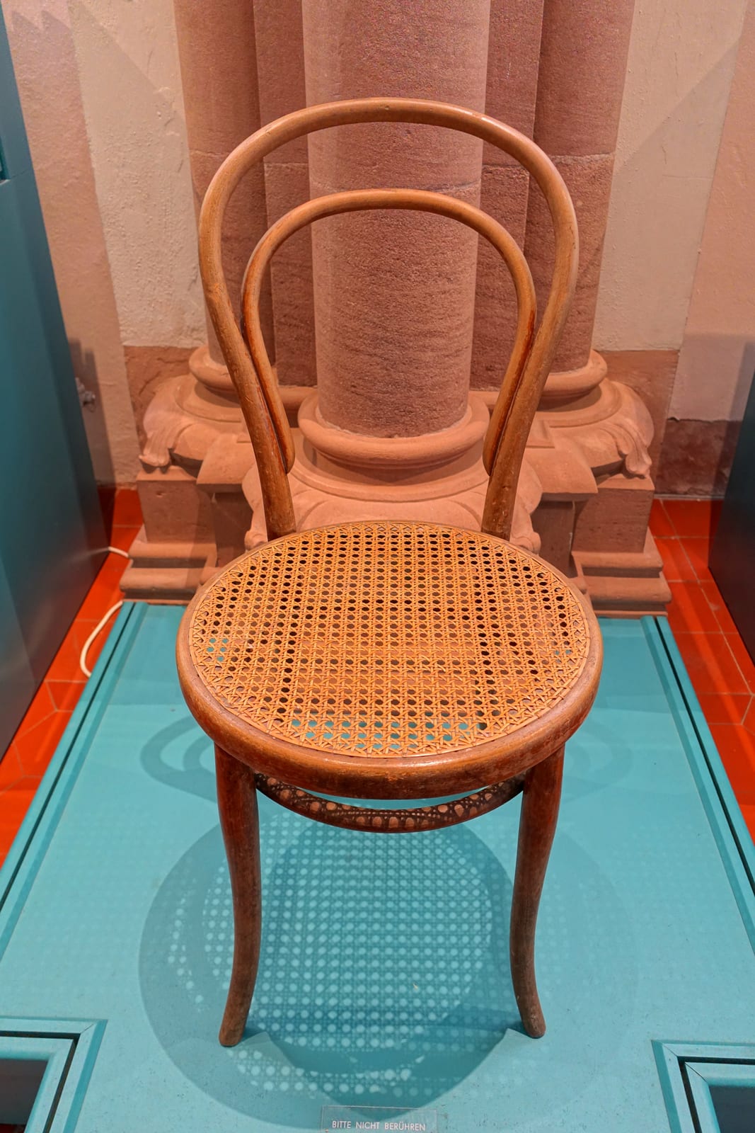 Thonet's Model No. 14 (1859) — steam-bent beech, the first mass-produced global chair and the ancestor of all flat-packed furniture.