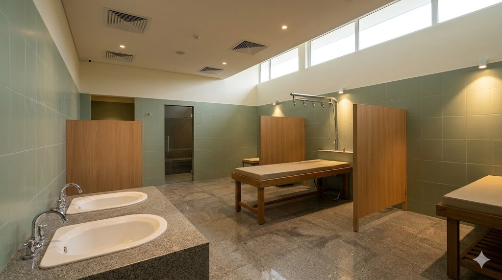 Naturopathy hydrotherapy suite — sitz bath and spinal-bath stations, slip-resistant granite, traditional aesthetic