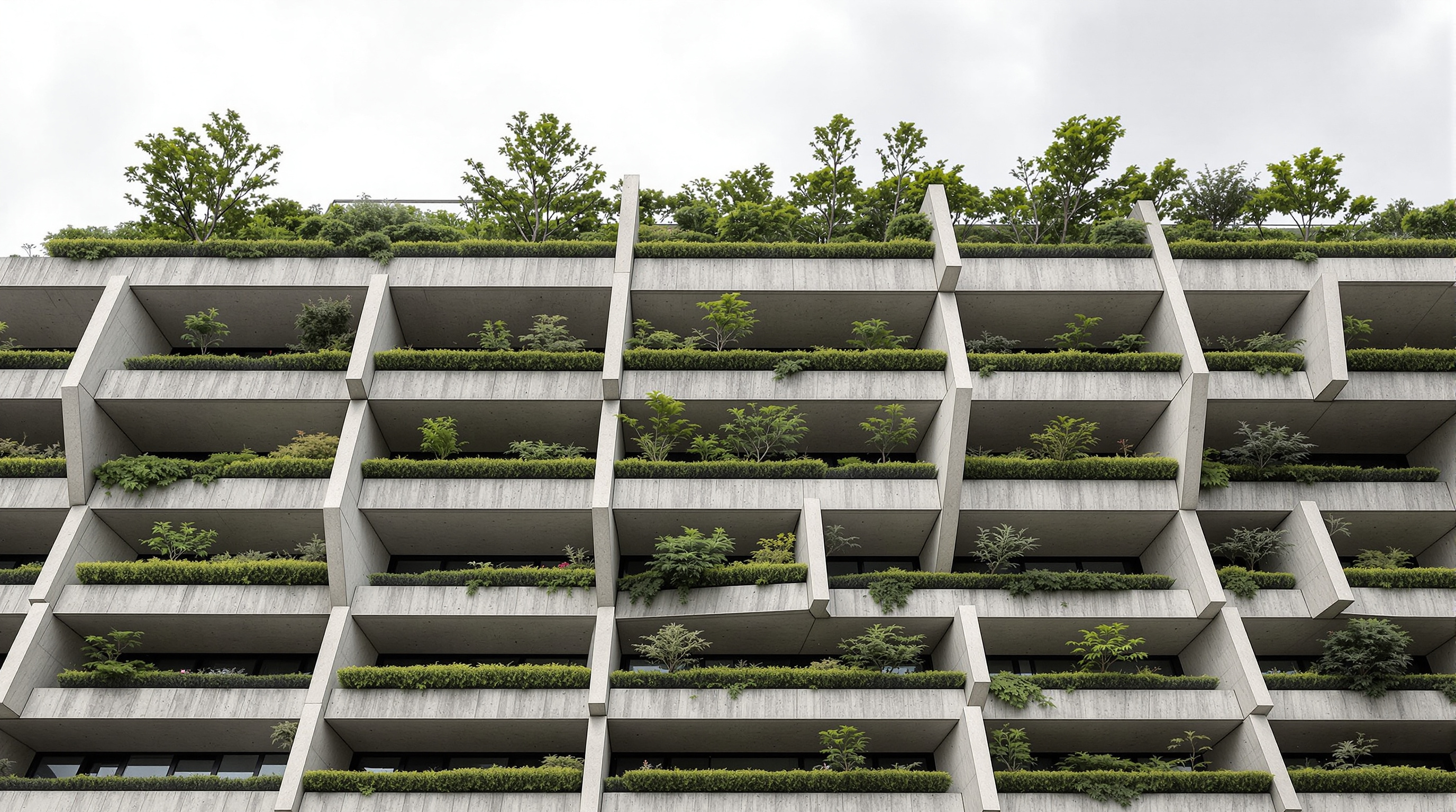 Close-up of the Trudo Vertical Forest facade showing deep concrete balconies with built-in planters, each holding a small tree and dense shrubs, the staggered edges leaving headroom for the canopies, greenery overhanging the concrete against a grey Eindhoven sky
