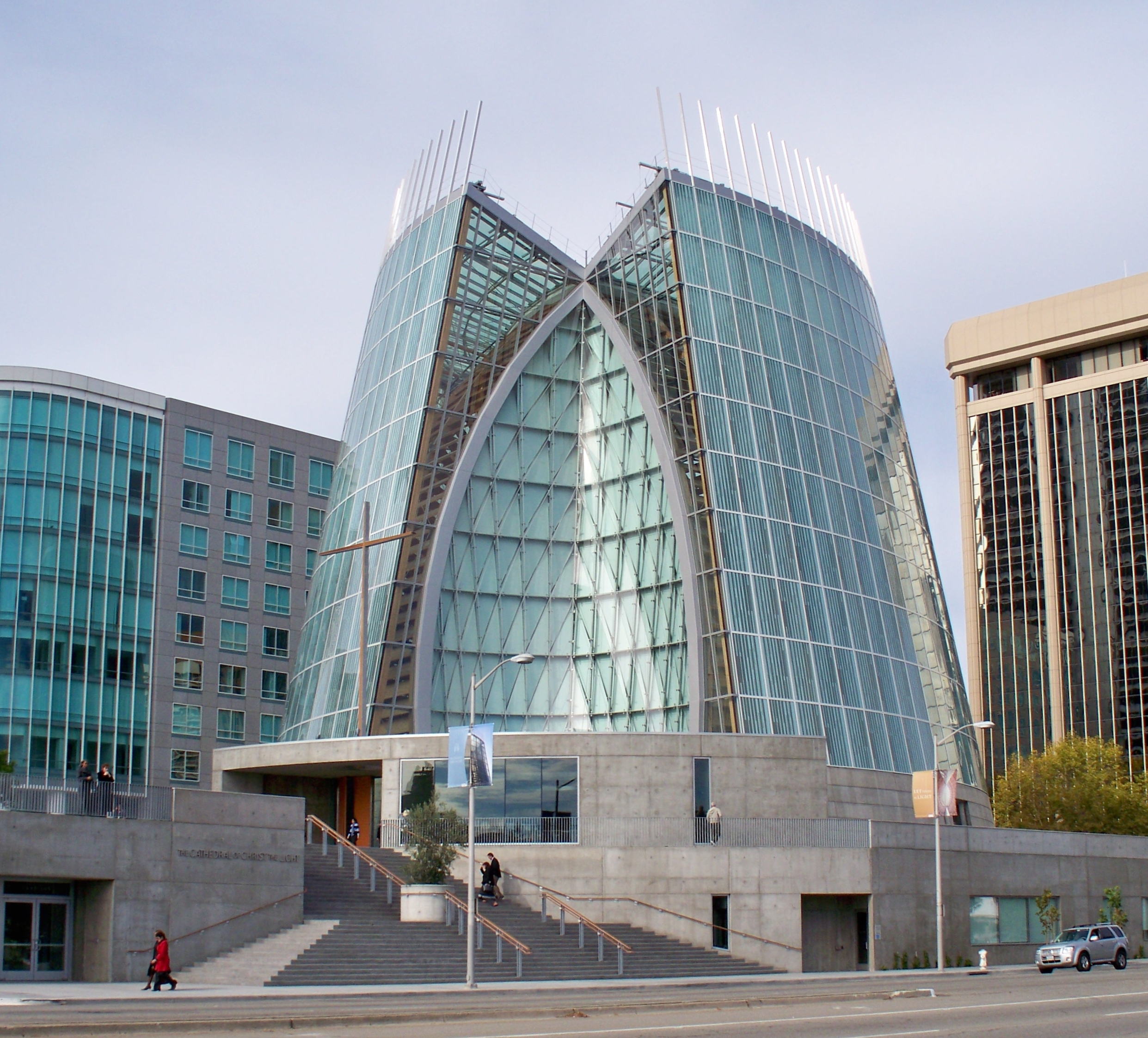 Exterior view of the Cathedral of Christ the Light, Oakland, showing the glass-veiled pointed vessel above its concrete base.