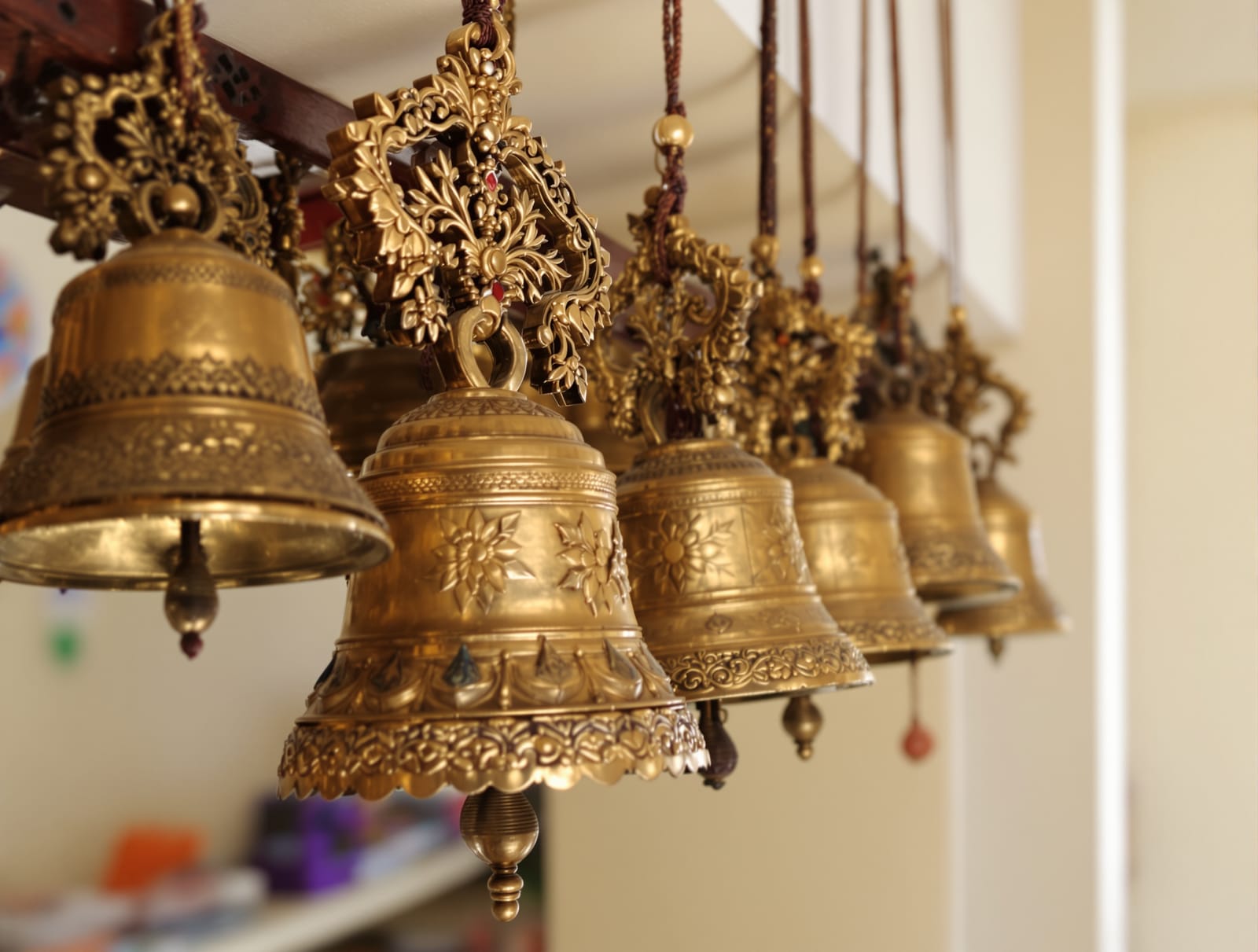 Ornate traditional Indian brass temple bells as decor in an Indian home