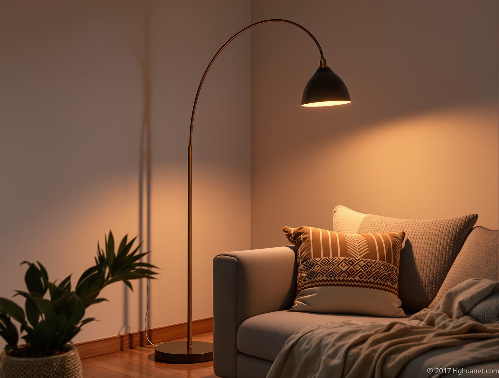 An arc floor lamp beside a sofa in an Indian living room