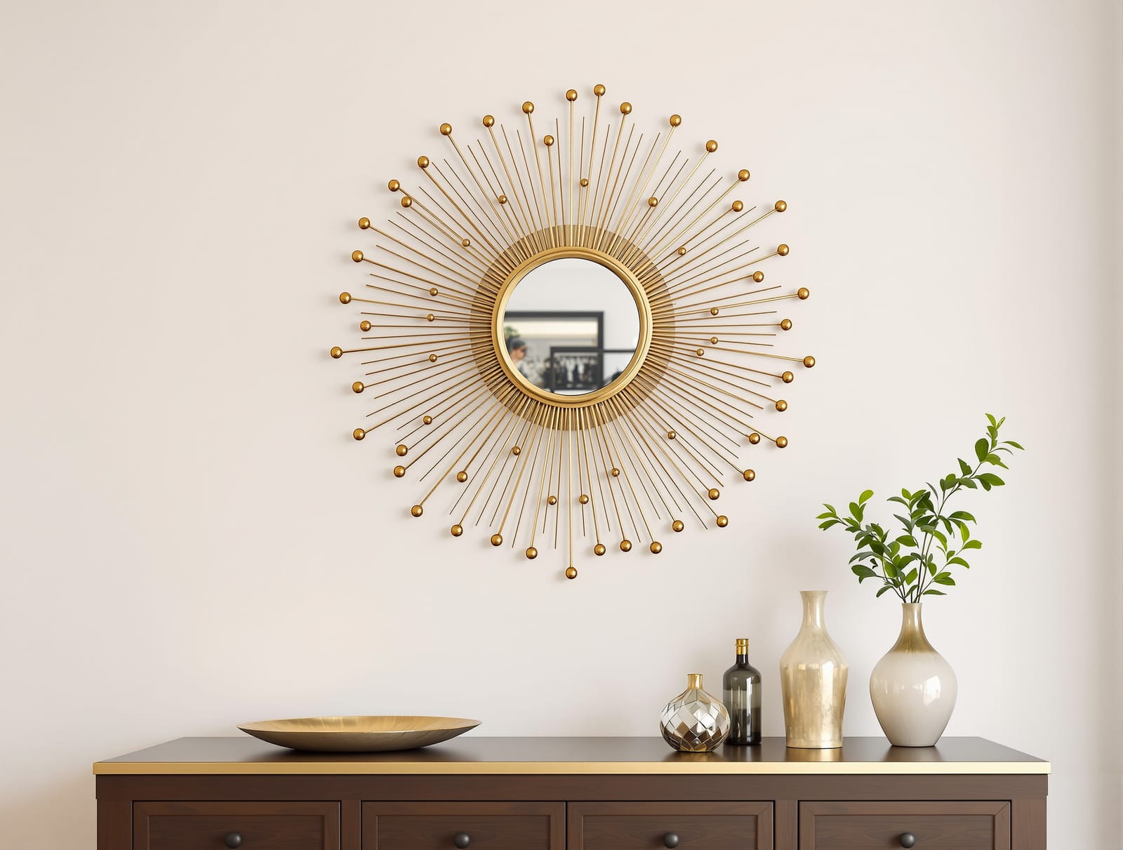 A gold sunburst mirror above a console in an Indian living room