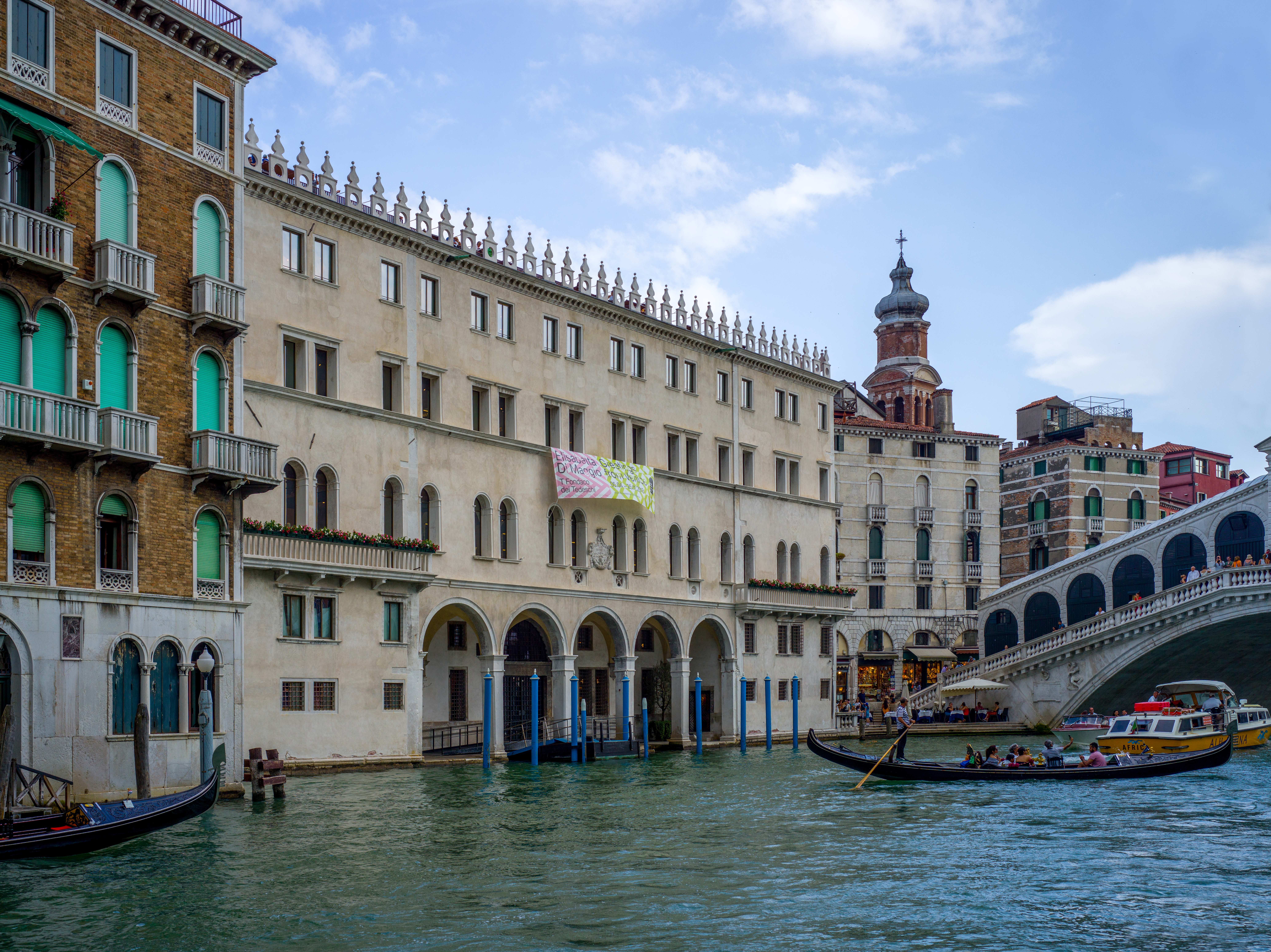 Exterior of the Fondaco dei Tedeschi seen from the Grand Canal, near the Rialto Bridge.