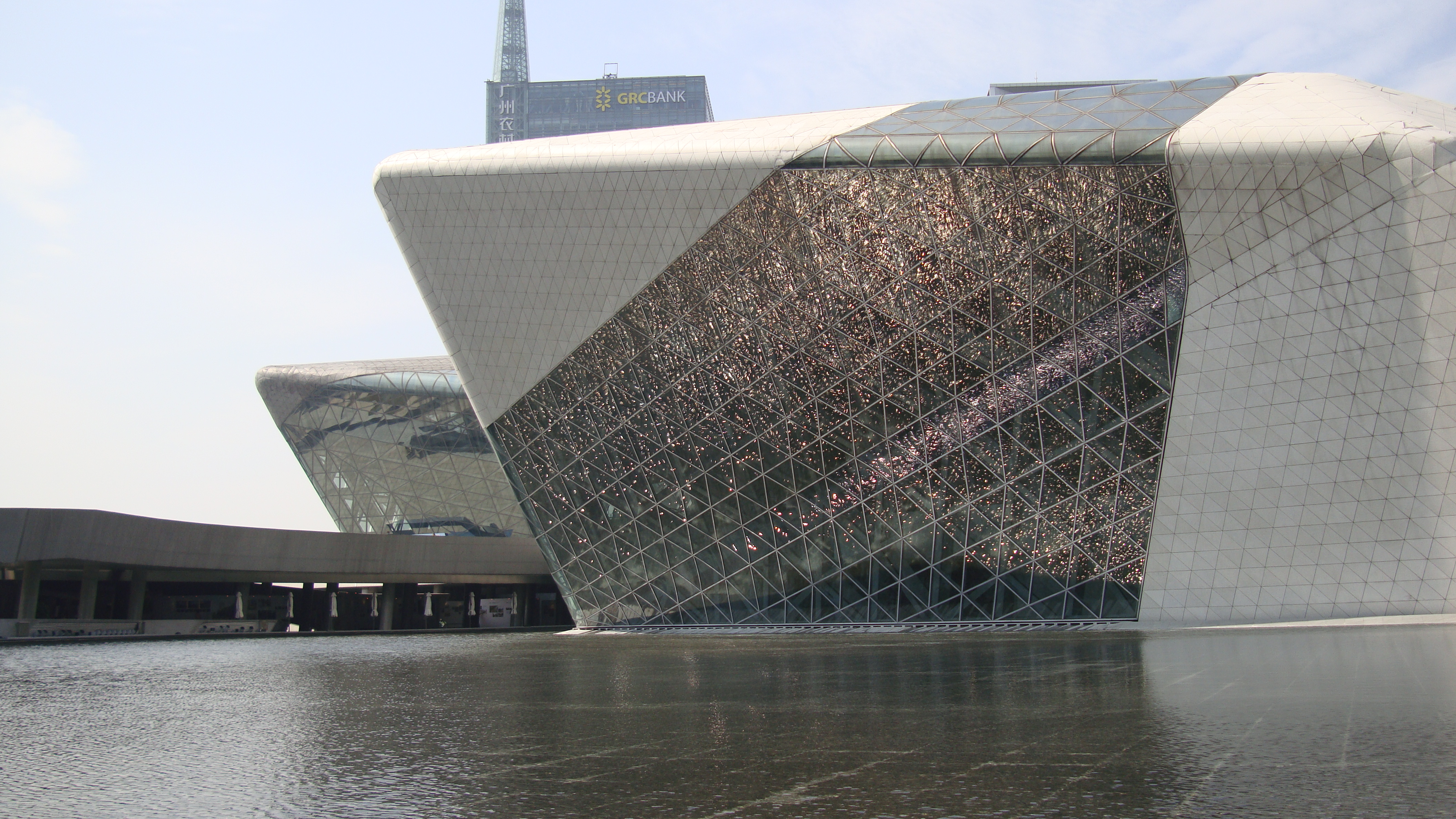 Close exterior view of the faceted granite boulder forms of the Guangzhou Opera House.