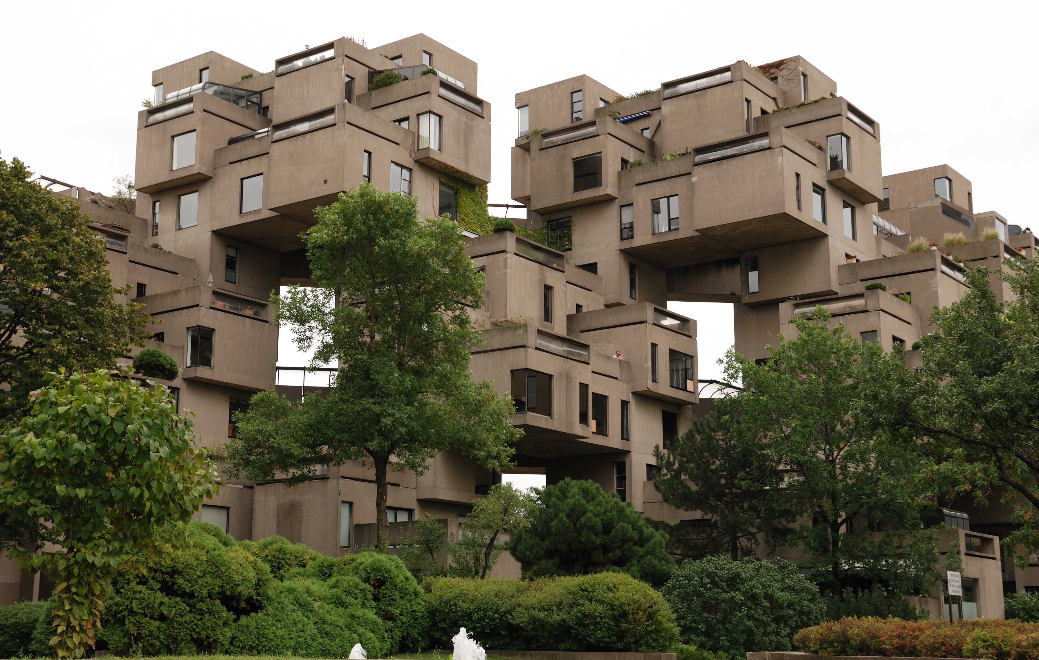 Wide exterior view of Habitat 67's stacked concrete modules on the Montreal waterfront