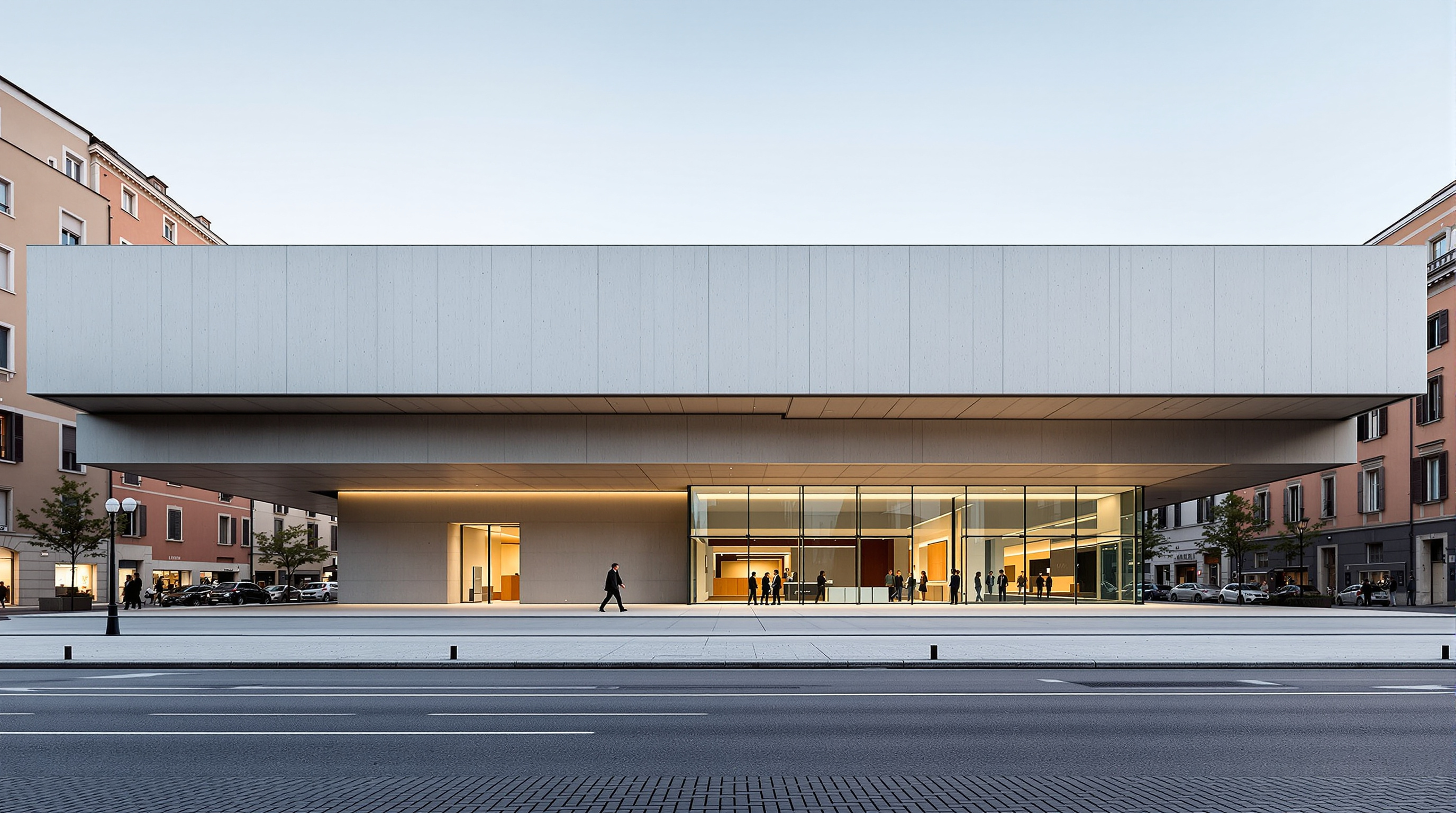 The exterior of MAXXI at street level in the Flaminio district of Rome, a long horizontal band of smooth grey concrete cantilevering outward above the entrance forecourt, its underside lit, with a strip of glazing revealing the galleries within