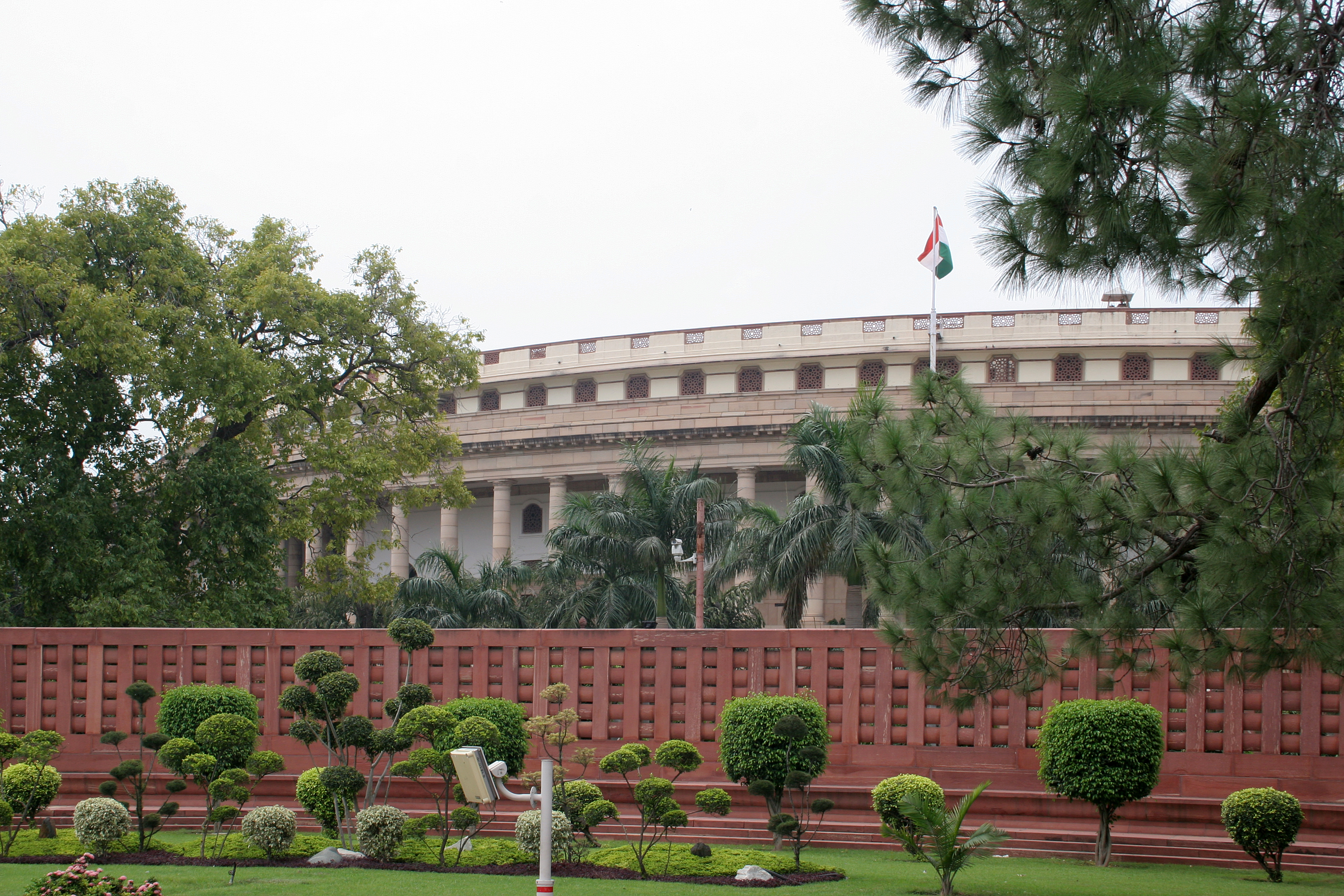 Exterior photograph of the new triangular Parliament building (Sansad Bhavan), New Delhi.