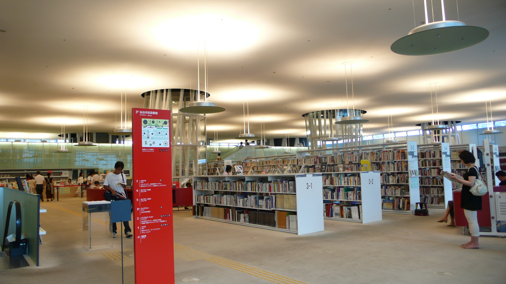 Interior of a third-floor open plate at the Sendai Mediatheque, showing the beam-free ceiling and latticed steel tubes.