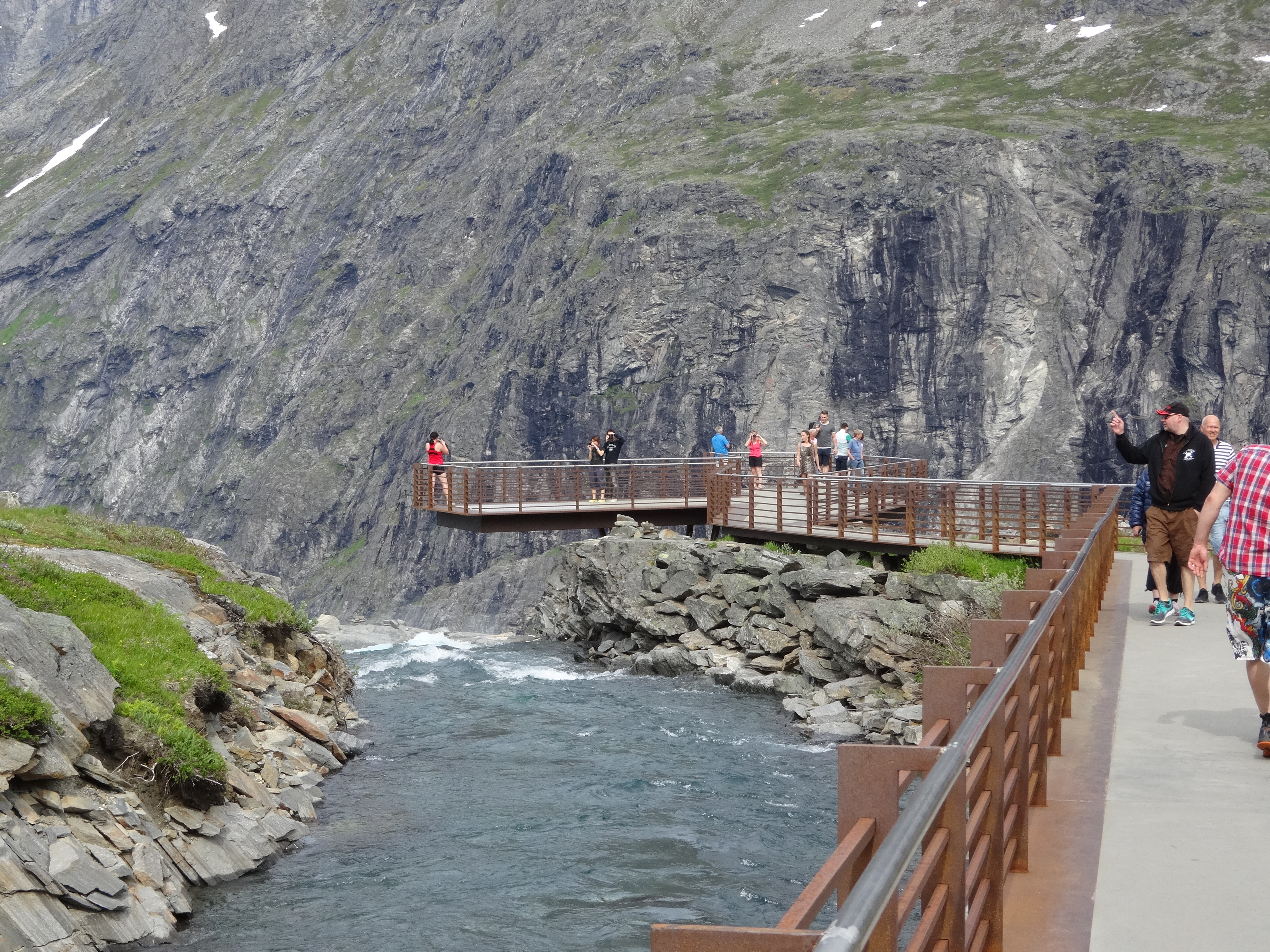 The upper cor-ten steel viewing platform at Trollstigen, showing the cantilever and balustrade over the cliff edge.