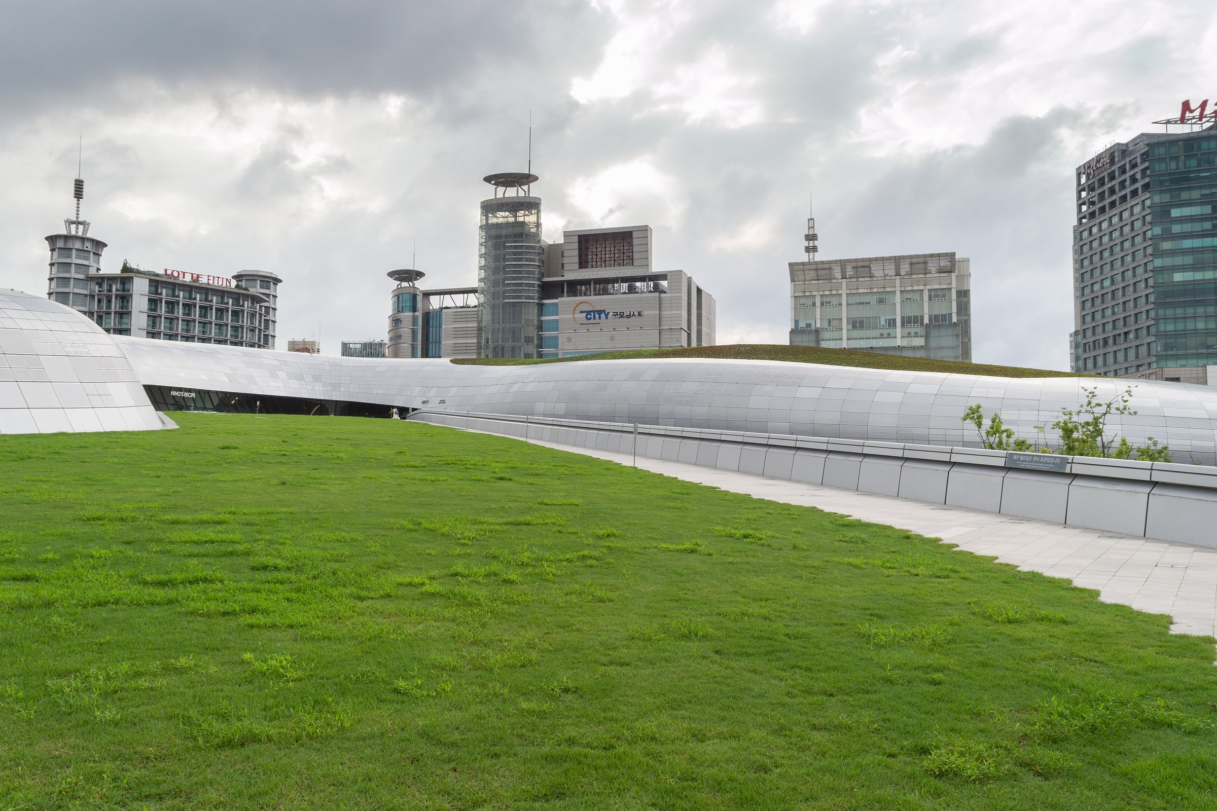 The grass roof and flowing silver skin of the Dongdaemun Design Plaza (2014), Seoul, by Zaha Hadid Architects