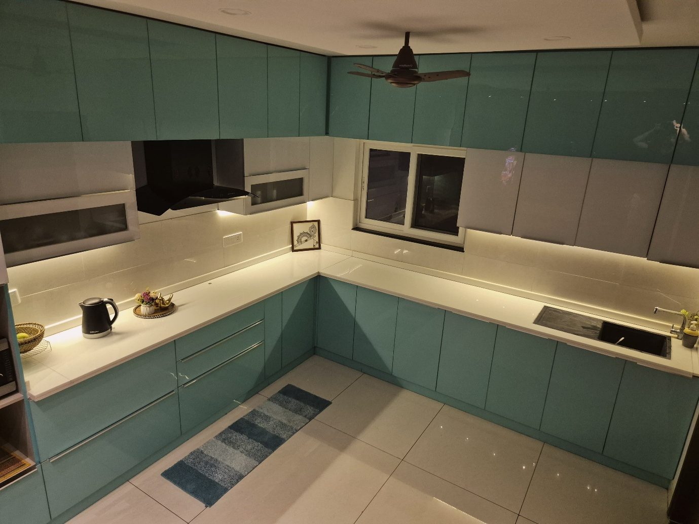 A blue-and-white fitted kitchen