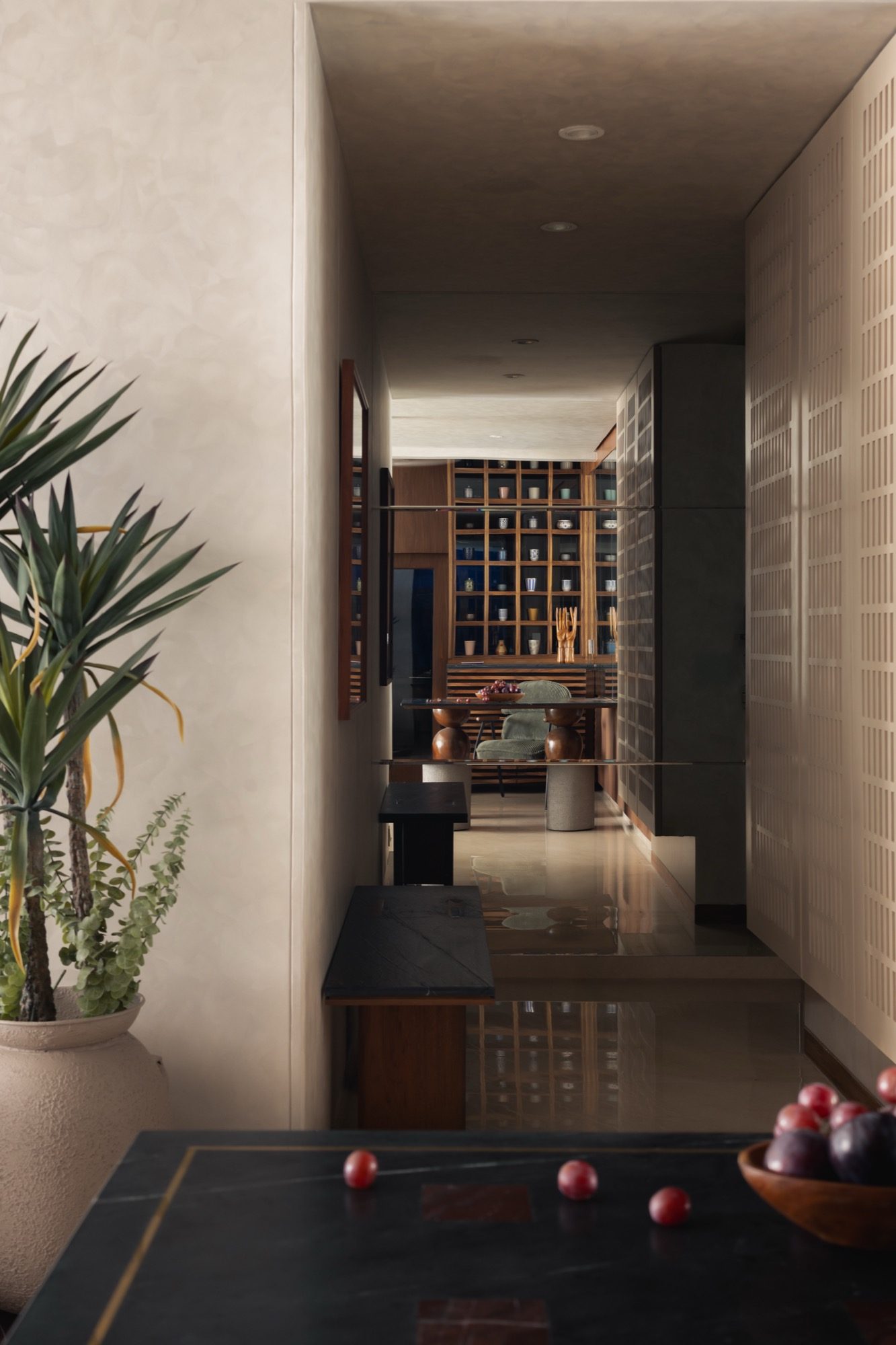 Warm material palette — teak, stone and raw brass
