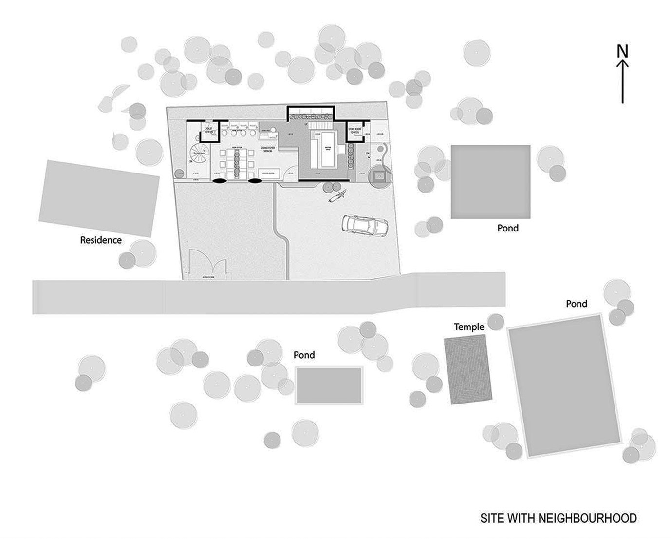 Site plan of The Violet Office with its neighbourhood, ponds, a temple and a residence, with a north arrow