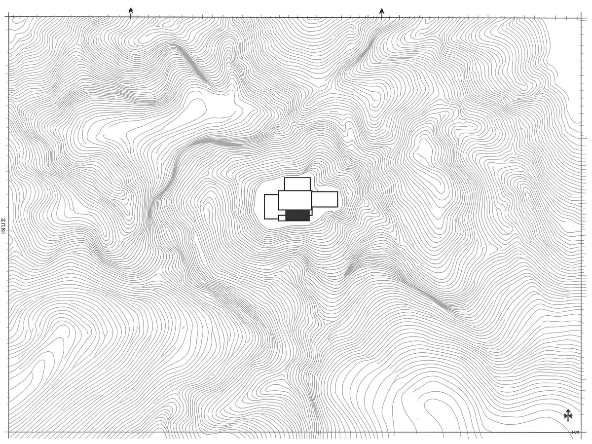 A site plan of flowing contour lines with a graphic scale bar and a north arrow, the building footprint sitting as a firm dark figure.