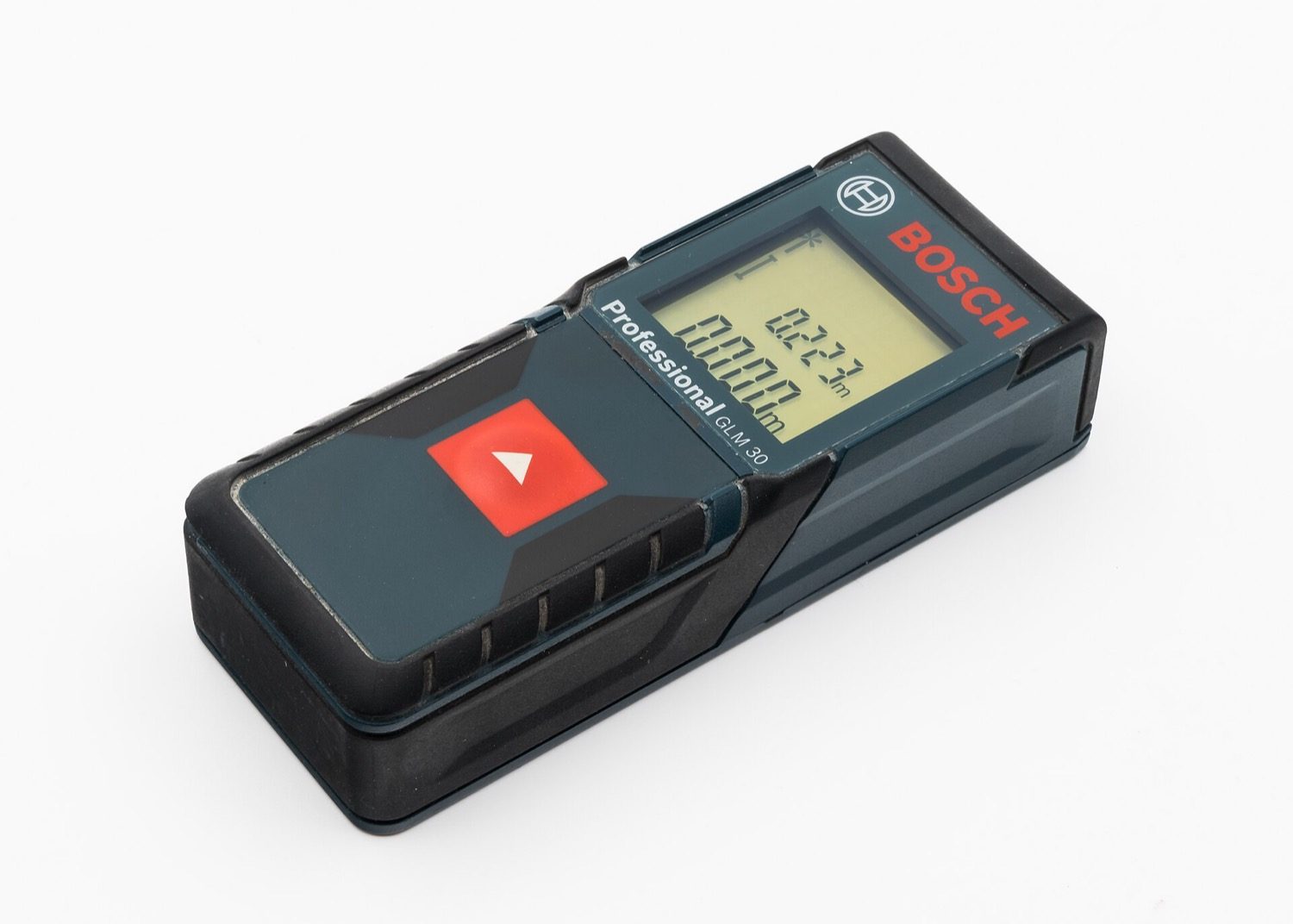 A laser distance meter measuring a room in an old building.
