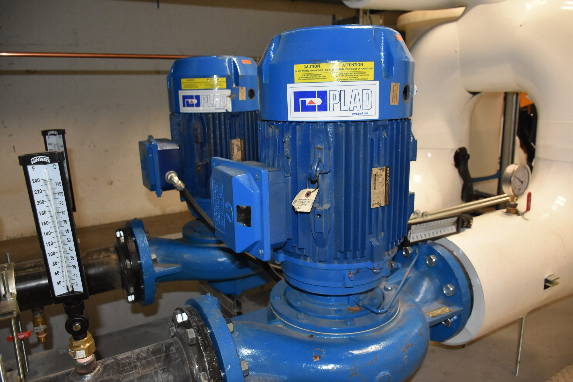 A centrifugal water pump set — the rotating impeller that lifts and boosts water through a building.