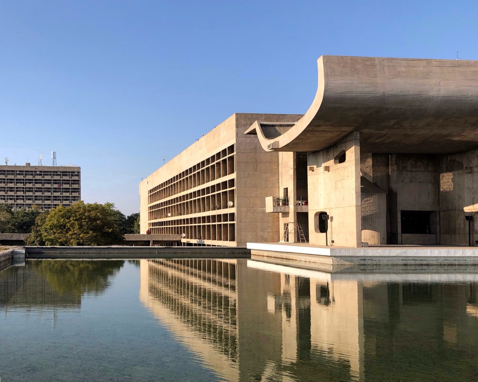 The Palace of Assembly, Chandigarh (Le Corbusier, completed 1962) — béton brut and the hyperboloid assembly chamber of the Capitol Complex.
