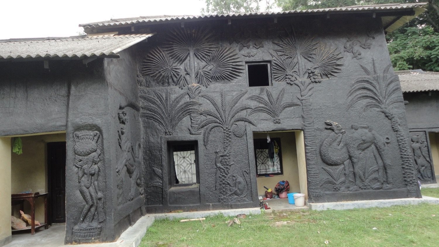 A decorated mud house — tangible fabric and intangible craft, both worth documenting.