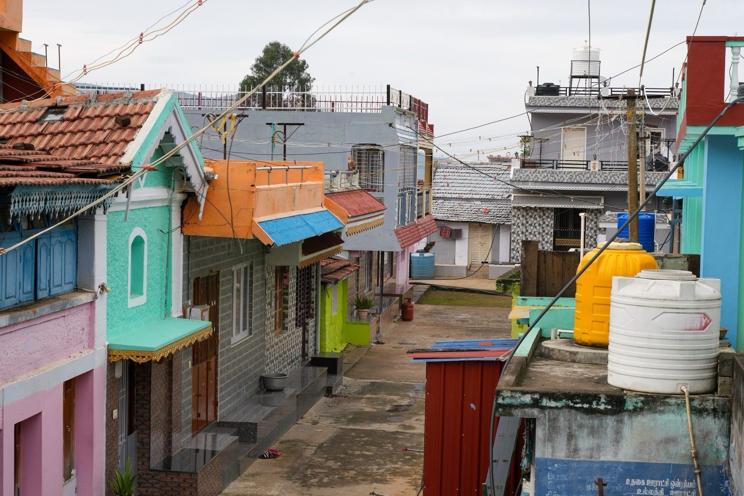 A village lane of houses — settlement pattern, house types and materials to record on a transect.