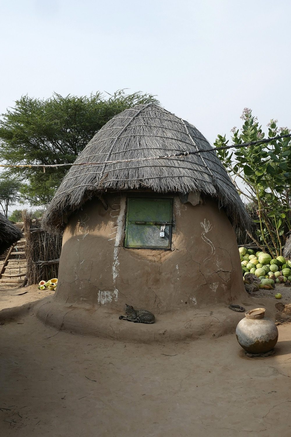 A rural village house of local materials, shaped by climate, craft and family use.