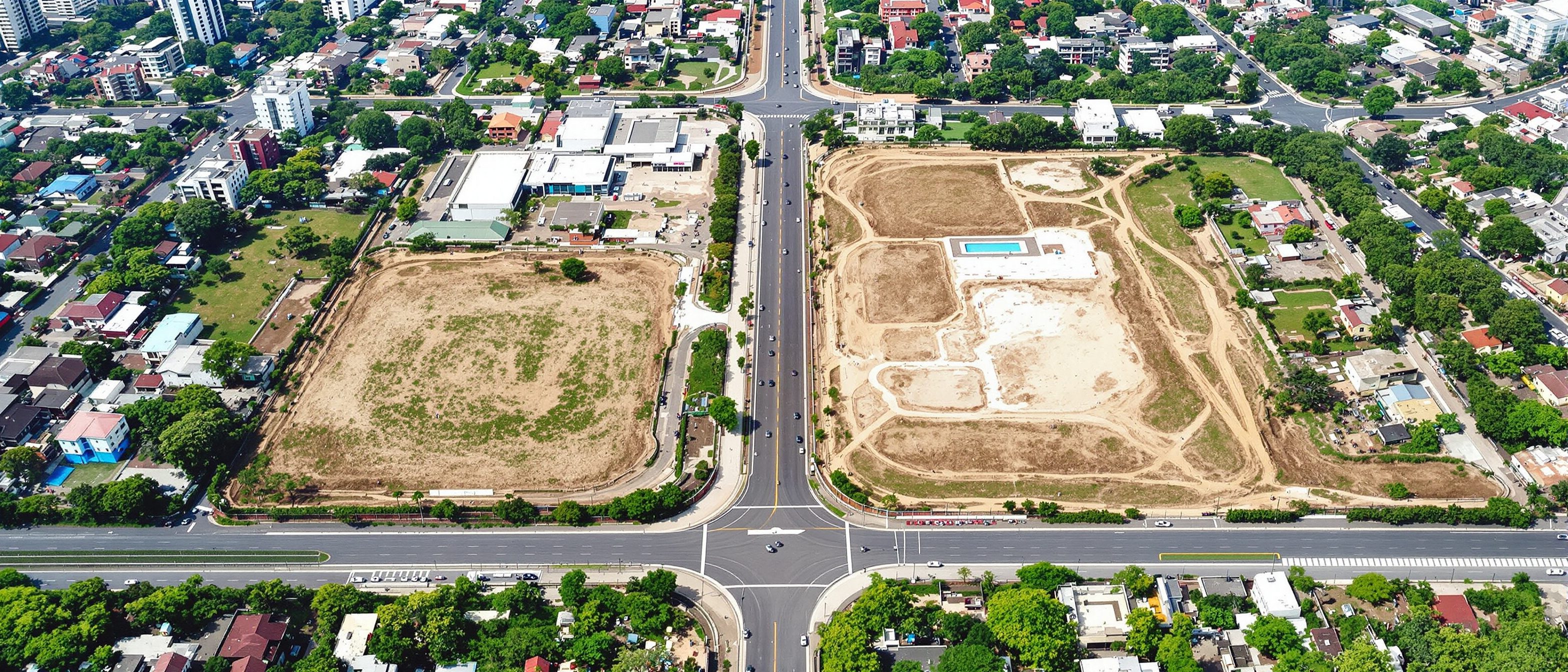 An aerial view of an urban site and its context of streets, plots and an approach road — the piece of city a public building must negotiate before a single room is drawn.