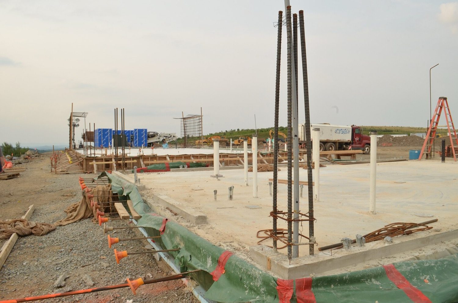 A column rebar cage showing the longitudinal bars and the closely-spaced ties that restrain them from buckling.