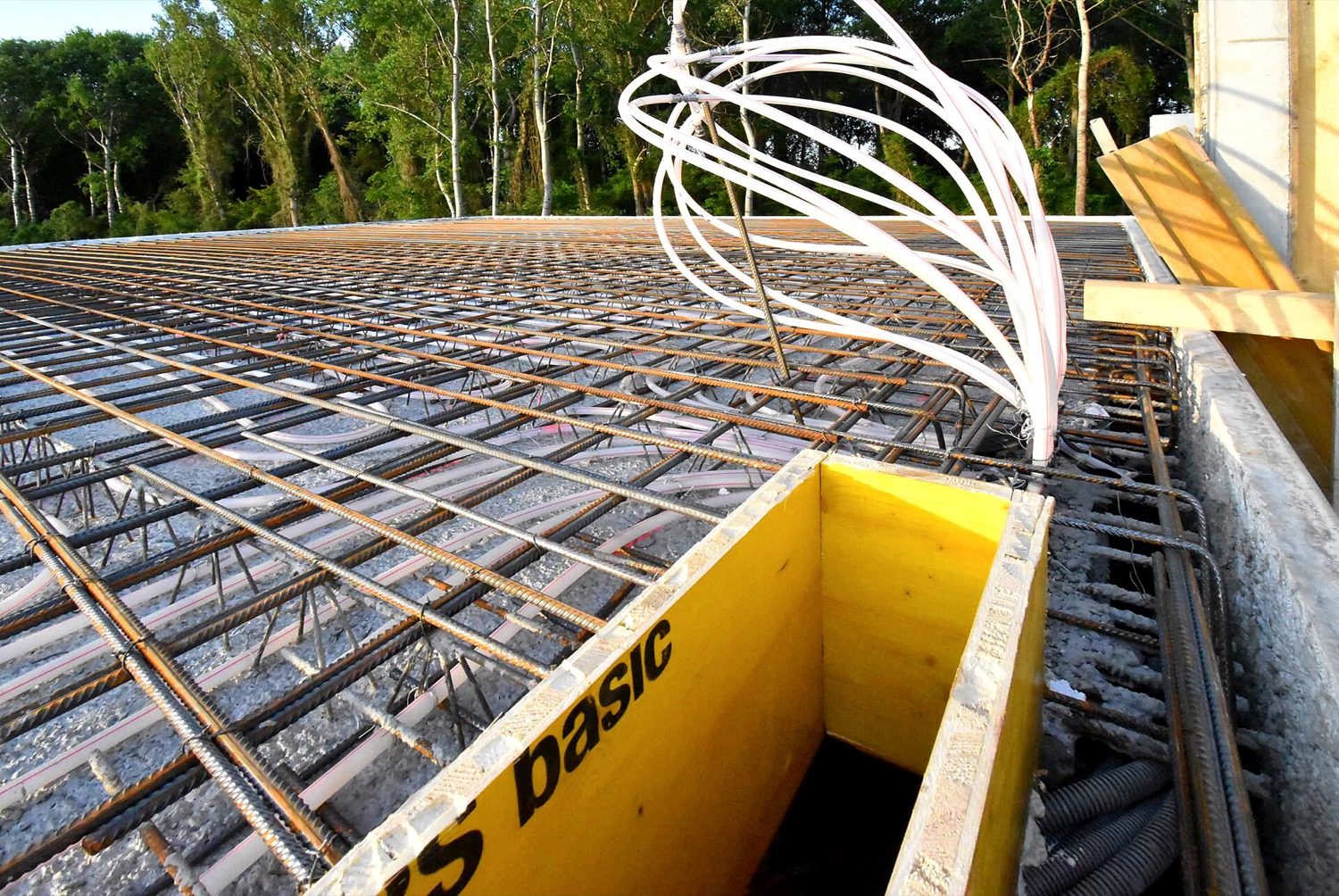 Two layers of slab reinforcement on chairs — the main and distribution bars tied into a mat.