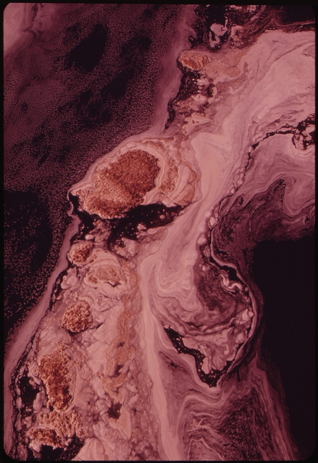 A foamed, polluted river receiving untreated effluent.