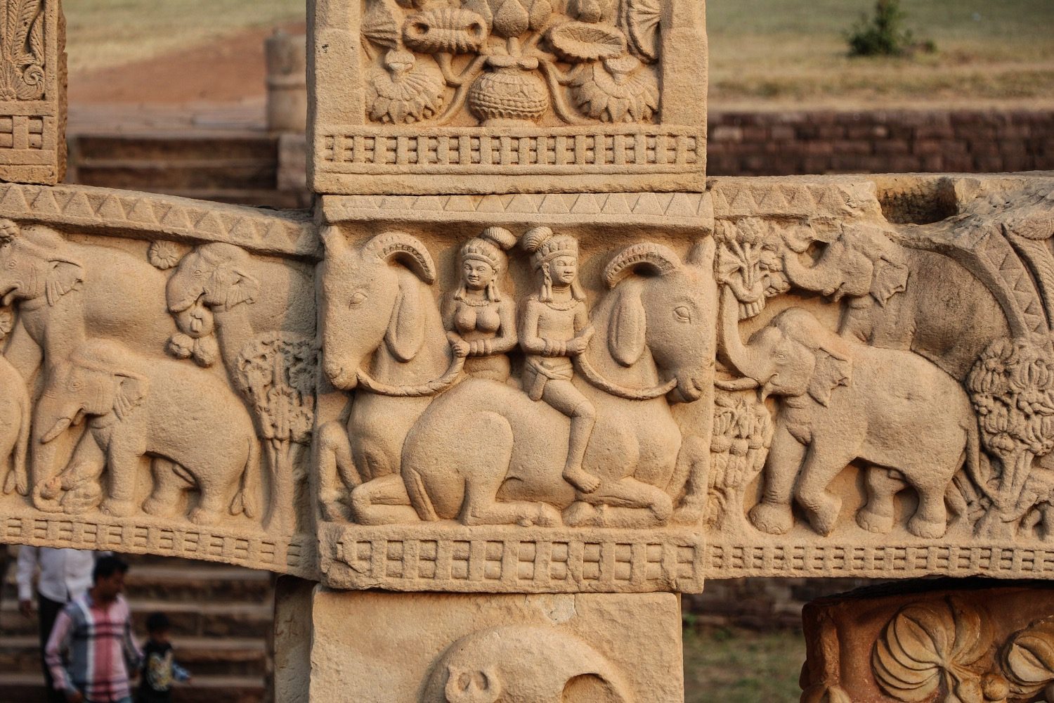 A richly carved torana (gateway) at Sanchi, its architraves crowded with relief narrative.