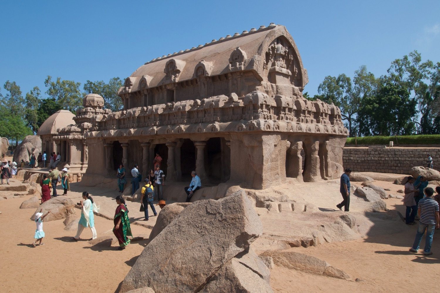 The Pancha Rathas at Mahabalipuram — five monolithic shrines, each carved whole from the granite.