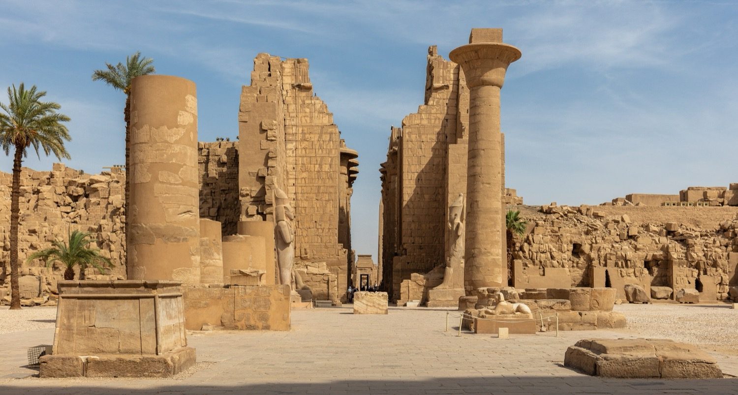 The Great Hypostyle Hall at Karnak — a forest of 134 sandstone columns, the taller central nave once clerestory-lit.