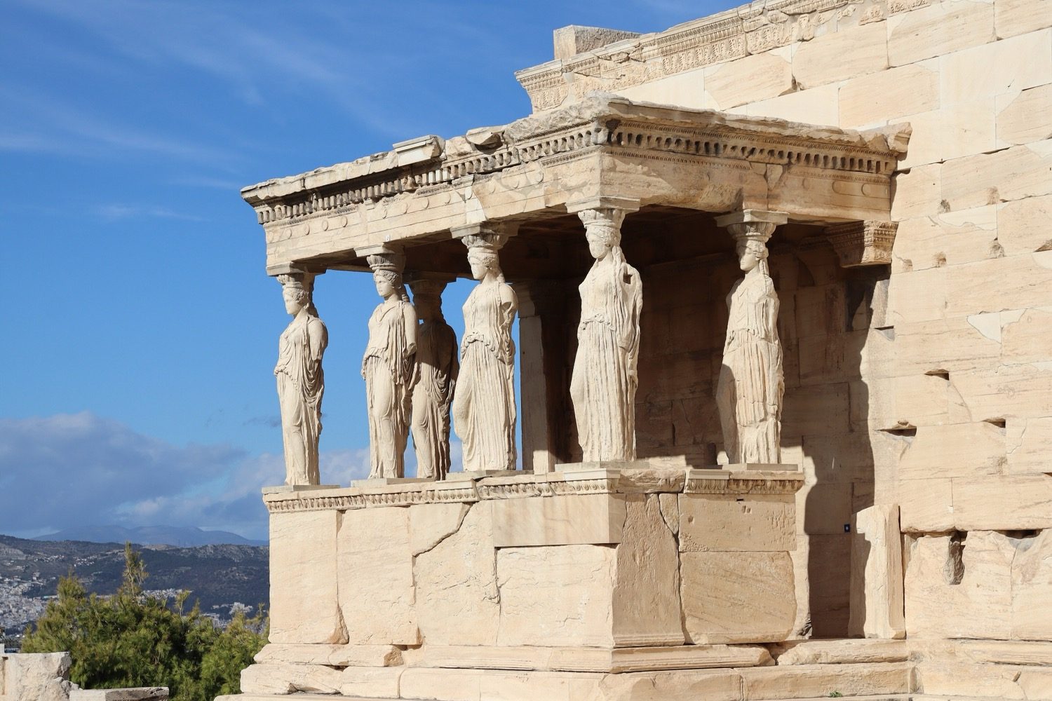 The Porch of the Maidens on the Erechtheion — six Caryatid figures serving as columns.