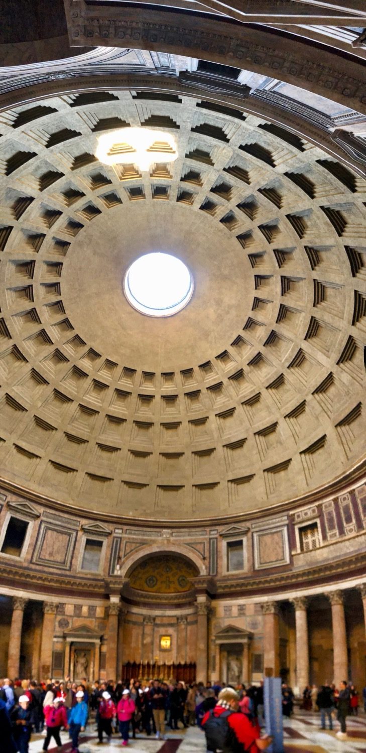 The interior of the Pantheon — its coffered concrete dome 43.3 m across, lit only by the central oculus.
