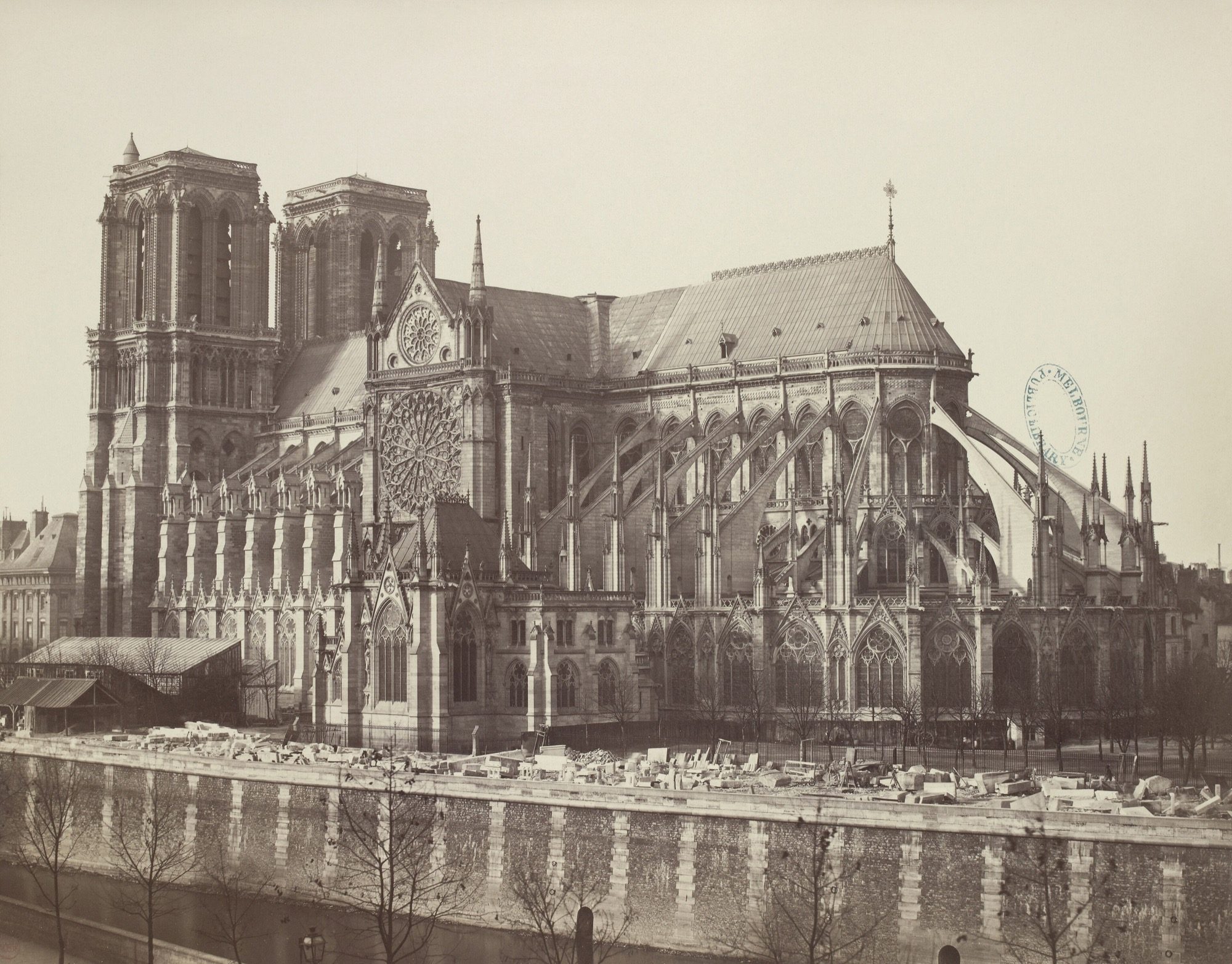 Notre-Dame de Paris — the long flank and apse ringed by flying buttresses, in a historic photograph; the early Gothic benchmark, begun in 1163.