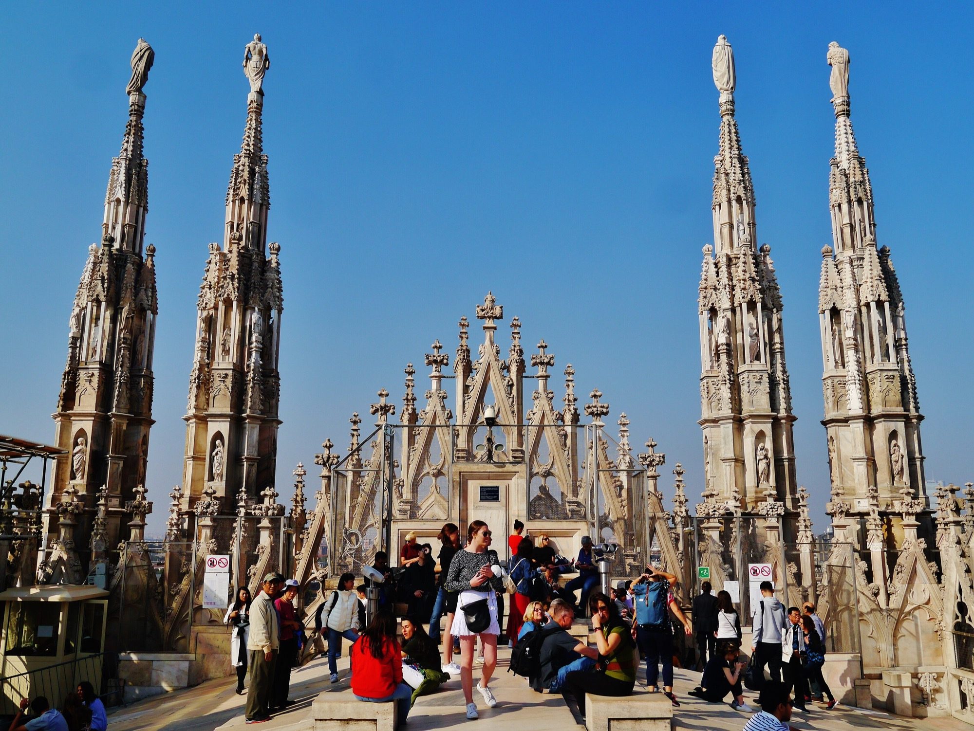 The forest of marble pinnacles and statuary on the roof of Milan Cathedral (Duomo di Milano) — Italian Gothic begun in 1386.