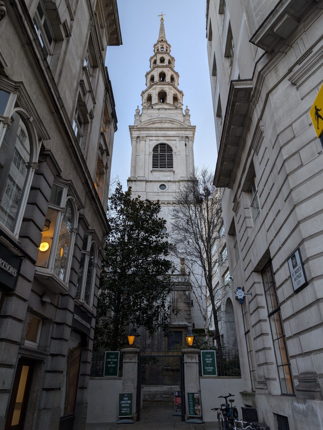 A Wren City church steeple — St Bride's, Fleet Street — rising over London, part of the rebuilding after the Great Fire of 1666.