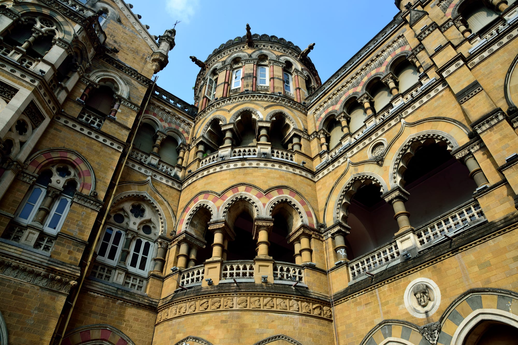 Chhatrapati Shivaji Terminus (Victoria Terminus), Mumbai — modern railway iron-and-glass wrapped in an exuberant Indo-Gothic stone skin.